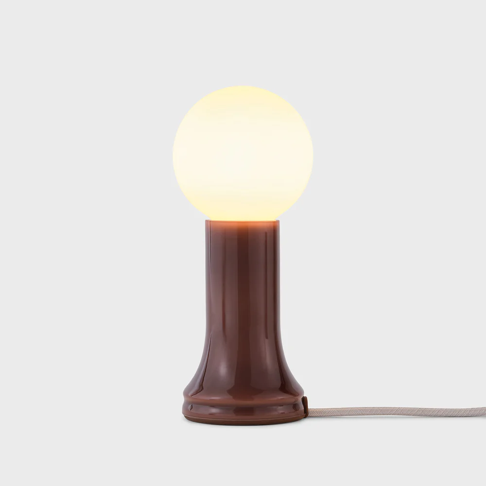 Decorative table lamp with G95 bulb included, 3.75" width x 8.875" height, 6W, 500LM, Warm Dim, CRI 95, Bottle Brown finish. Includes dimmer, E26 base, 120" cord, mouth-blown recycled glass body, suitable for Damp Location.